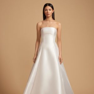 Allison Webb Baxley Wedding Dress - Snow mikado A-line gown with crescent neckline, and origami half bow, and chapel train. Optional pearl illusion halter.