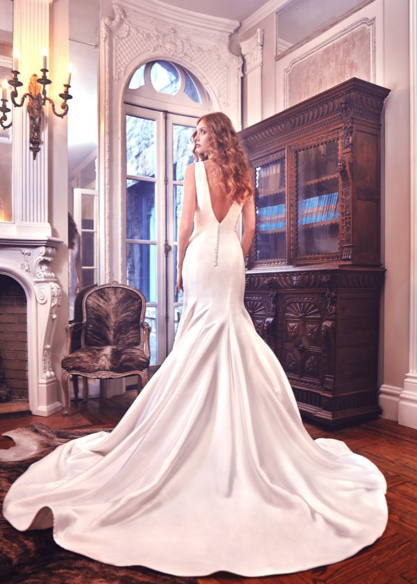 Sareh Nouri Mercer wedding dress - Fitted trumpet gown featuring a V-neckline, V-back, cathedral length train and accented with button detailing