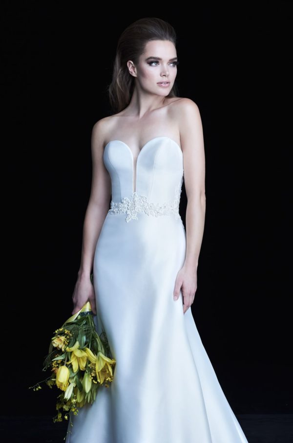 Paloma Blanca 4765 Wedding Dress Sample Sale - Fit and flare guipure Lace and satin Twill with a deep plunging sweetheart neckline, lace on back and belt detail.