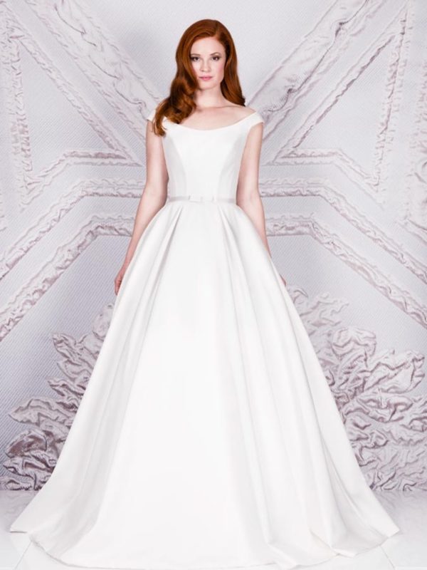 Suzanne Neville Monet Wedding Dress - Stunning off the shoulder ball gown with bateau neckline and belt detail in zibeline with princess seams.