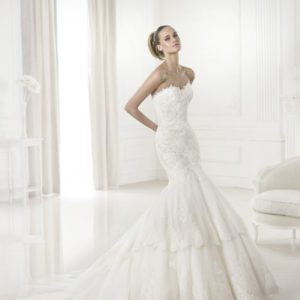 Pronovias Barquilla Wedding Dress Sample Sale - Off the shoulder, tulle mermaid dress with lace appliqués and crystal gemstone embroidery.