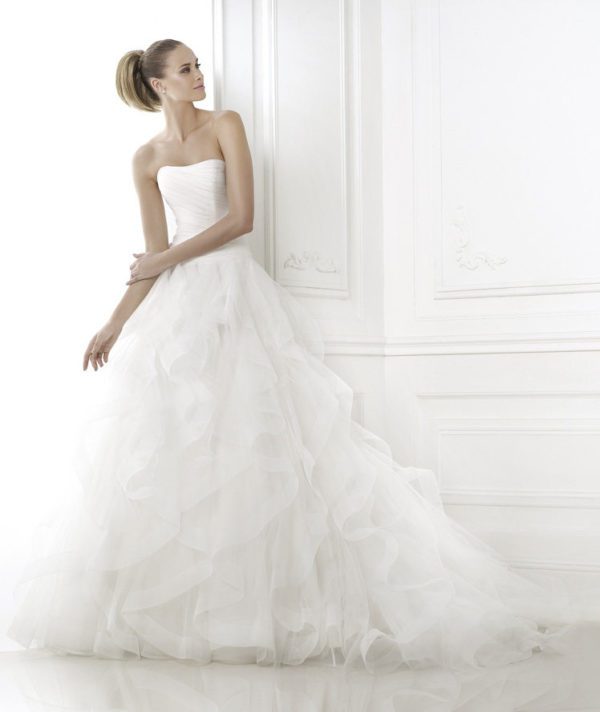 Pronovias Belia Wedding Dress Sample Sale - Stunning draped bodice dress with bateau neckline, frilly tulle skirt edged and a delicate nylon ribbon.