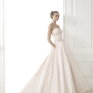 Pronovias Bluma Wedding Dress Sample Sale - Strapless A-Line style dress with a sweetheart neckline, fitted draped bodice, belt detail and pockets.