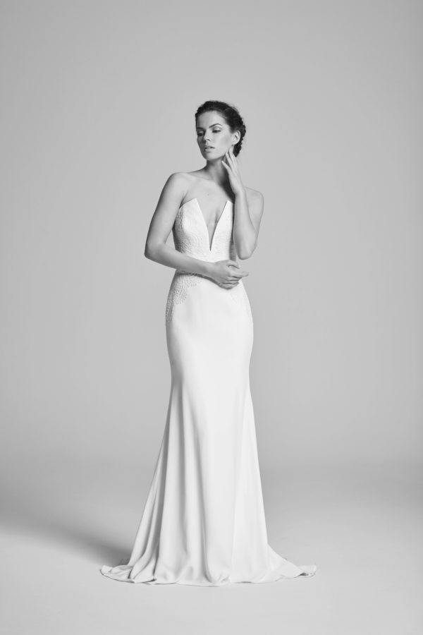 Suzanne Neville Delphine Wedding Dress - Sheath timeless classic strapless Crepe dress with a showstopping deep v-neckline and lace appliqué.