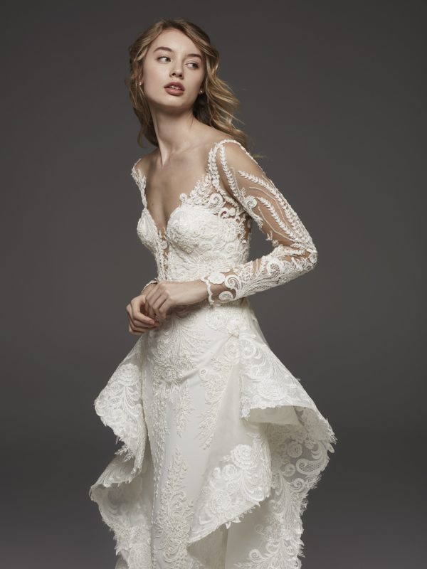 Pronovias Hevea Wedding Dress Sample Sale - Mermaid dress with fitted bodice and overskirt in tulle, long sleeves, deep v neckline with sweetheart cut.