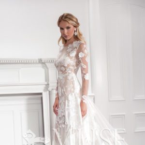 Modern Trousseau Brielle Wedding Dress - A - Line style dress with Scattered rose embroidered tulle over a fitted body and illusion long sleeves.