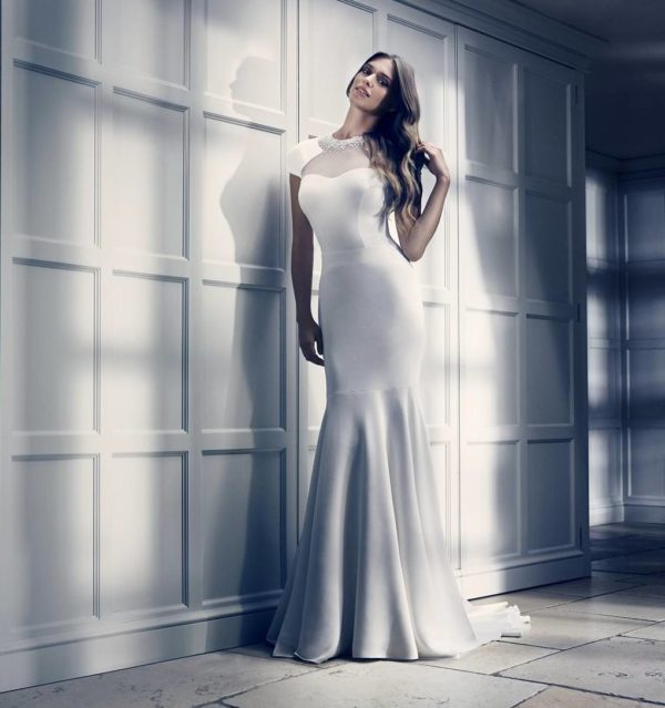 Suzanne Neville Memoire Wedding Dress Sample Sale - Fit and flare dress with cap sleeves, sweetheart neckline, illusion high neckline and beaded details.