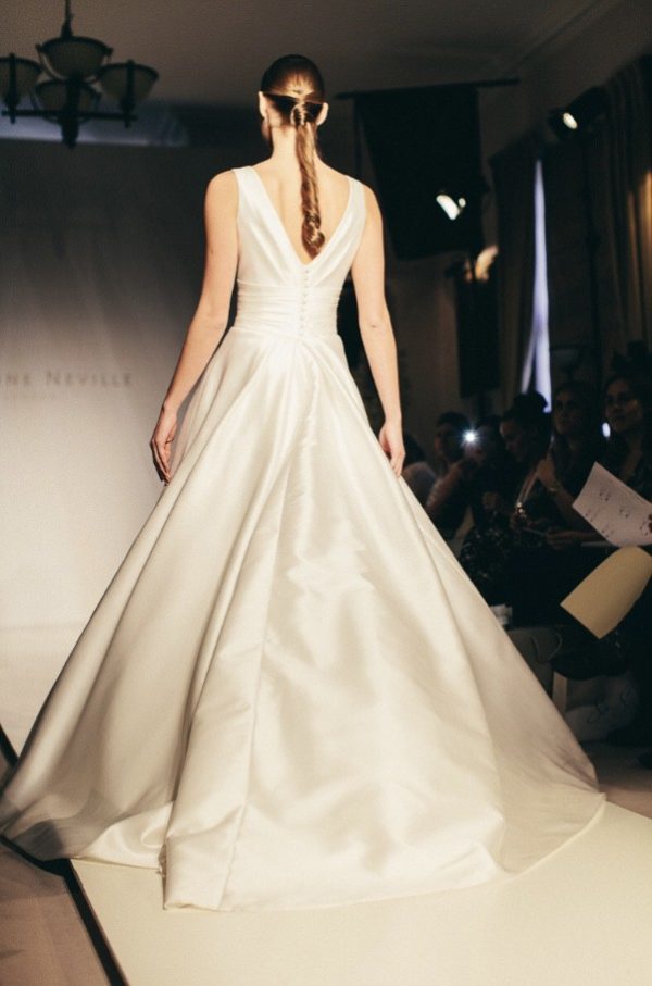 Suzanne Neville Novello Wedding Dress - Ball gown style dress with deep V-Neckline, low back, shoulder straps and waist band.