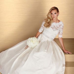 Paloma Blanca 4667 Wedding Dress - A Line skirt with cropped lace top, bateau neckline, ¾ sleeves, and sweetheart neckline on lining.