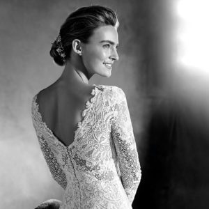 Pronovias Atelier Eludia Wedding Dress - Long sleeve, mermaid dress in tulle, lace and guipure with a V-neckline, V-back and extra long skirt.