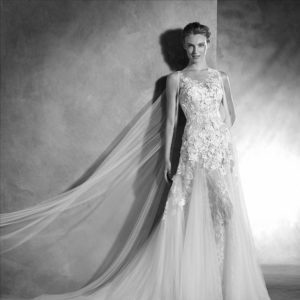 Pronovias Nelsia Wedding Dress Sample Sale - A-line dress with floral appliqué and stunning detachable tulle cape, illusion bodice, v-neckline and train.