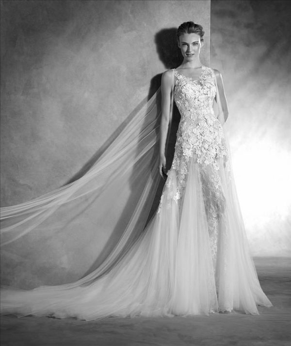 Pronovias Nelsia Wedding Dress - Elegant A-line dress with appliqué flowers and stunning detachable tulle cape, illusion bodice, v-neckline and train.
