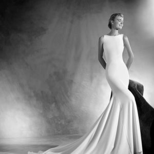 Pronovias Atelier Eimi Wedding Dress - Mermaid style dress in crepe with a bateau neckline in the front, a sensual sheer and gauze layer at the back.