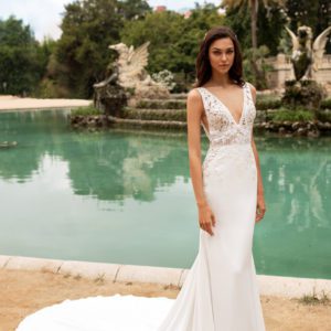 Pronovias Emily Wedding Dress - Contemporary crepe, fit and flare-style dress with draped v-neckline, halter neck back, train and keyhole cutaway.