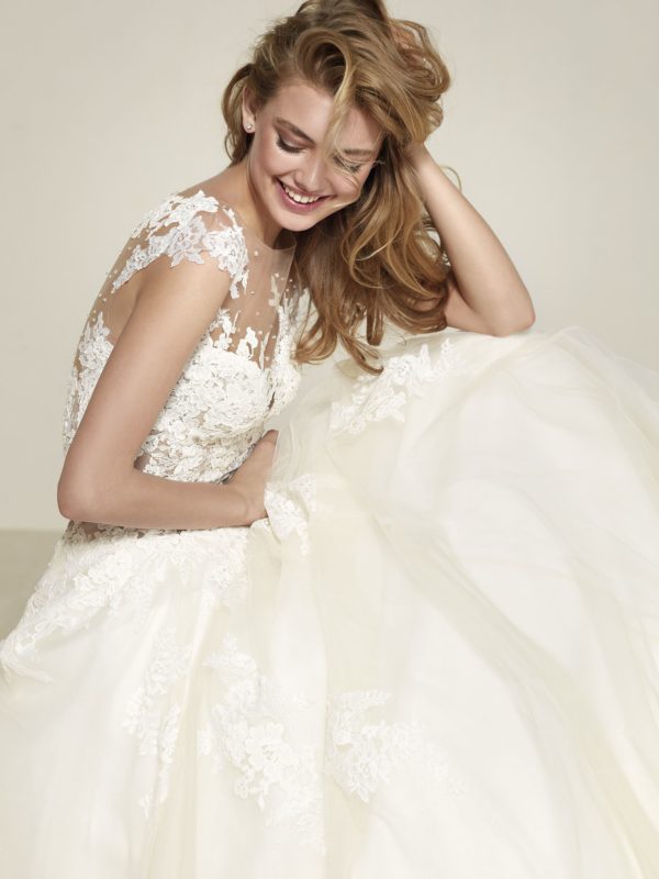 Pronovias Drisule Wedding Dress Sample Sale - Princess ballgown with a full skirt in layers of tulle, fitted bodice, embroidery all over and illusion neck.