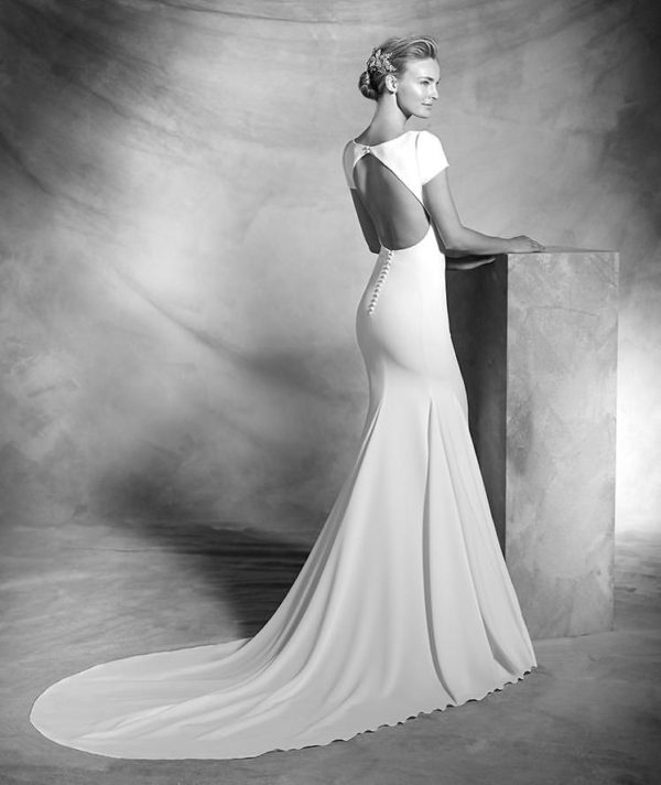 Pronovias Valeria Wedding Dress Sample Sale - Fit and flare style dress with a bateau neckline, fitted bodice, cap sleeves, large center back opening and long train.