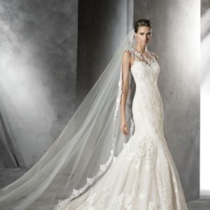 Pronovias Pladie Wedding Dress Sample Sale - Mermaid style dress with fitted bodice with an elegant sheer open back, an illusion neck and sweetheart cut.