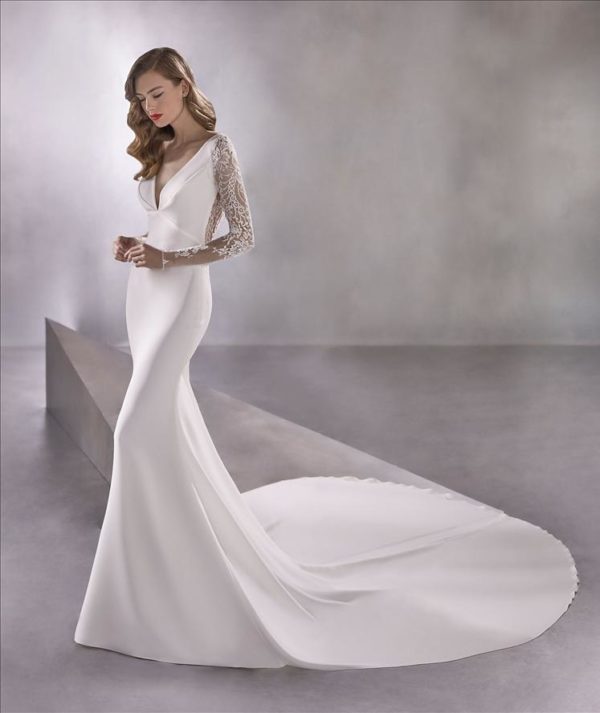 Pronovias Atelier Space Girl Wedding Dress - Mermaid style in crepe fabric with an elegant V-neckline bust and lace adorning the illusion sleeves and back.