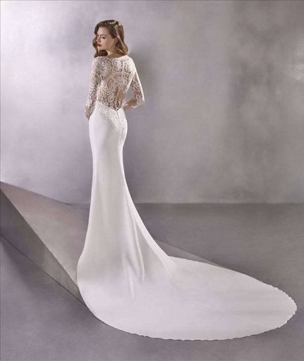 Pronovias Atelier Space Girl Wedding Dress - Mermaid style in crepe fabric with an elegant V-neckline bust and lace adorning the illusion sleeves and back.