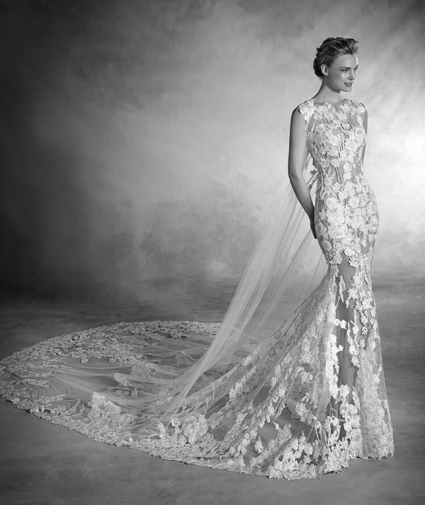 Pronovias Atelier Natura Wedding Dress Sample Sale - Mermaid style dress with allover illusion fabric, high neckline, cap sleeves, embroidery, and train.