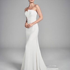 Suzanne Neville Alouette Wedding Dress - Fitted Sheath skirt gown with strapless neckline, and a perfectly draped bodice that exudes elegance. The sleek gown is for the bride looking for something classic yet totally chic.