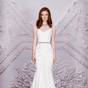 Suzanne Neville Raphael Wedding Dress Sample Sale - Fit and flare rouched crepe dress with beaded net illusion round neckline, cap sleeves and beaded belt.