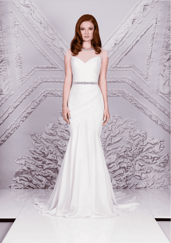 Suzanne Neville Raphael Wedding Dress Sample Sale - Fit and flare rouched crepe dress with beaded net illusion round neckline, cap sleeves and beaded belt.