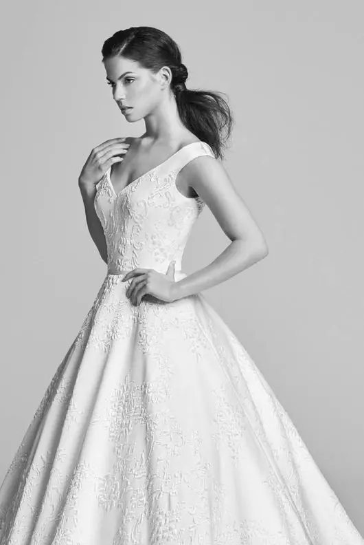 Suzanne Neville Vienna Cloque Wedding Dress - Off the-shoulder straps A Line dress in ivory damask with v-neckline and small train.