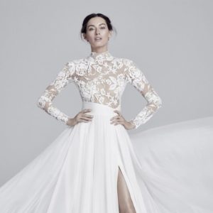 Suzanne Neville Luella Wedding Dress - A Line dress with long sleeves, illusion lace bodice, high neckline, and chiffon skirt with front slit.