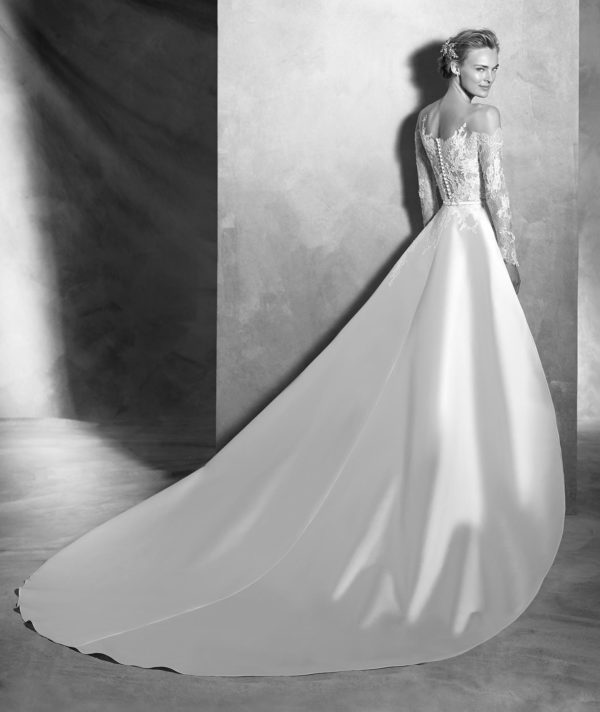 Pronovias Atelier Vitorial Wedding Dress Sample Sale - Fit and flare style dress in silk mikado with chantilly lace, long sleeves, cutout shoulder, and detachable train