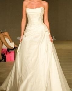 Suzanne Neville Besotted Wedding Dress - A Line strapless dress with soft scoop neckline, rouched bodice and bow on left hip.