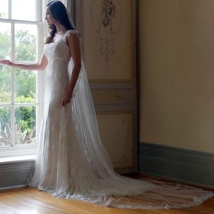 Suzanne Neville Charisse Wedding Dress - Stunning A-line, fitted dress with square neckline, straps, silver and ivory lace overlay and an illusion neckline.