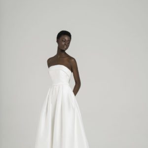 Peter Langner Gisele Wedding Dress - Strapless style silk dress with detachable foldoveron on neckline, belt detail with bow and pleats on skirt.