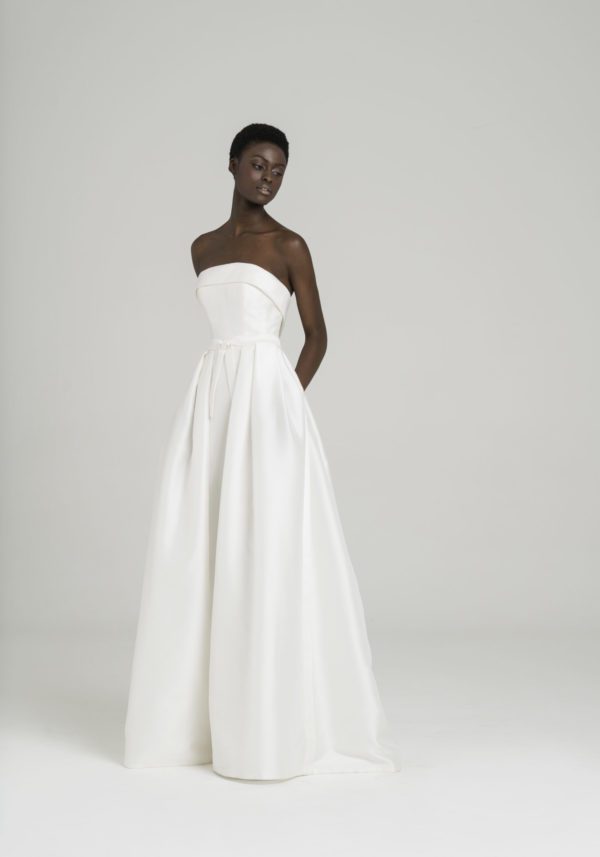 Peter Langner Gisele Wedding Dress - Strapless style silk dress with detachable foldoveron on neckline, belt detail with bow and pleats on skirt.