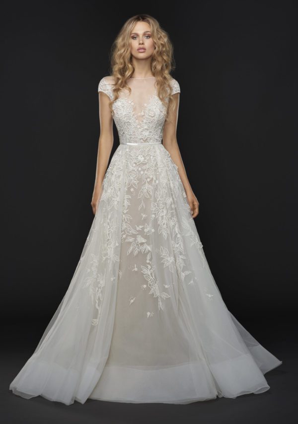 Hayley Paige Vaughn 6757 Wedding Dress Sample Sale - A Line dress with illusion bateau neckline, cap sleeve, low open back, belt detail and floral full skirt.