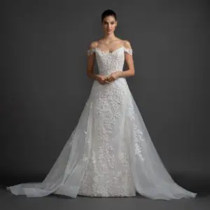 Lazaro Olivia 3914 Wedding Dress - Fit and flare ivory petal embroidered gown with off the shoulder sleeve, sweetheart neckline and detachable overskirt.