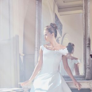 Sareh Nouri Ophelia Wedding Dress - Off the shoulder ball gown with gracing shoulder, drop waist, fitted bodice and pleats with buttons on train.