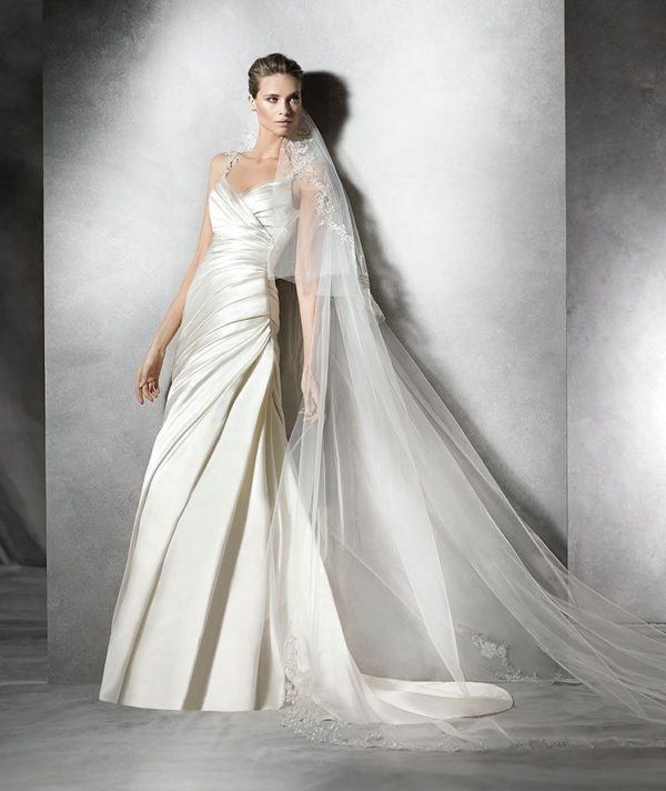 Pronovias Prunella Wedding Dress Sample Sale - Fit and flare style dress with draped satin fitted bodice and skirt, sweetheart neckline and gemstone straps.