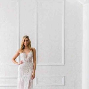 Estee Couture Nikki Wedding Dress - Fit and flare style in all-over beaded lace, v-plunging neckline, V back, crystal buttons and stunning cathedral train.