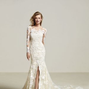 Pronovias Driate Wedding Dress Sample Sale - Mermaid dress with Illusion neck, long sleeves, semi sweetheart neckline, and front split in skirt with train.