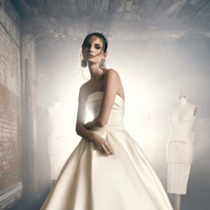 Sareh Nouri Elinor Wedding Dress - Strapless ballgown with drop waist, Shantung fabric featuring a straight-across tuxedo neckline and draped bodice.