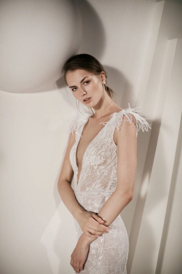 Alon Livne Valerie Wedding Dress Sample Sale - Fit and flare lace dress with a drop V-neckline front and back, feather details at the shoulders and around the hem.