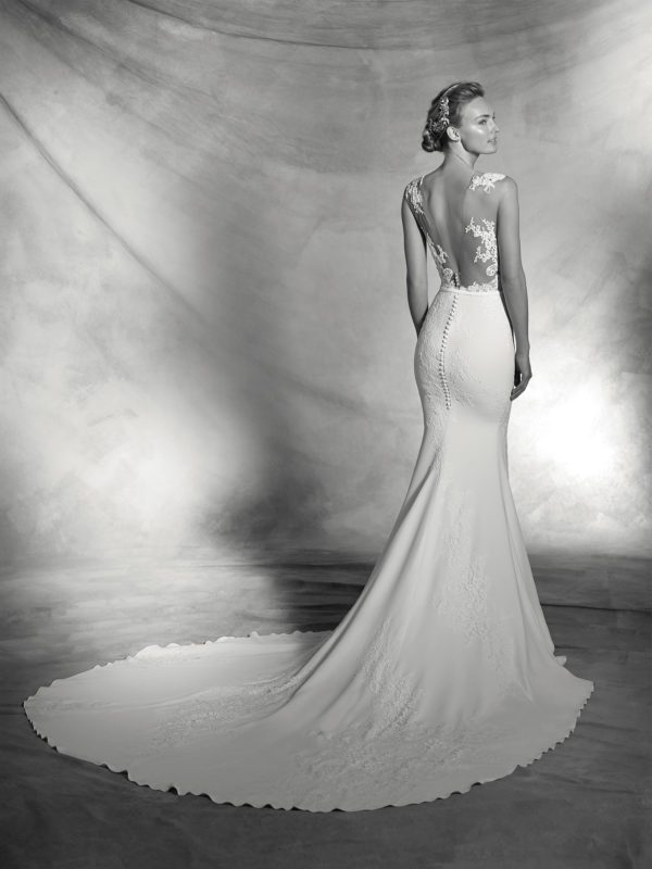 Pronovias Atelier Vicenta Wedding Gown - Crepe mermaid dress with sheer illusion tulle bodice, high neckline, lace appliqués, belt detail and open back.