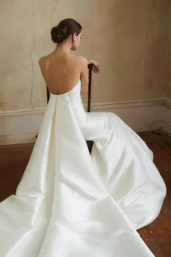 Allison Webb Beckwith Wedding Dress - Blended dupioni fit and flare gown, with a crescent neckline and a detachable watteau train.