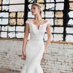 Tulle NY Beck Wedding Dress – Silk shantung, fit & flare, off the shoulder gown with a ruched cummerbund waistline and notched neckline.
