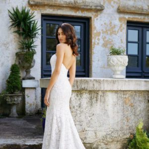 Allison Webb Laurel Wedding Dress - Fit and flare beaded Alencon lace gown, with a strapless curved neckline and buttons to the end of the train.
