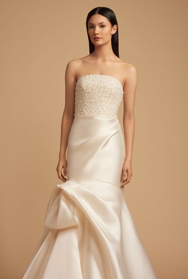 Allison Webb Penelope Wedding Dress - Ivory mikado asymmetrically draped fit to flare gown, with pearl crystal encrusted bodice with crescent neckline.