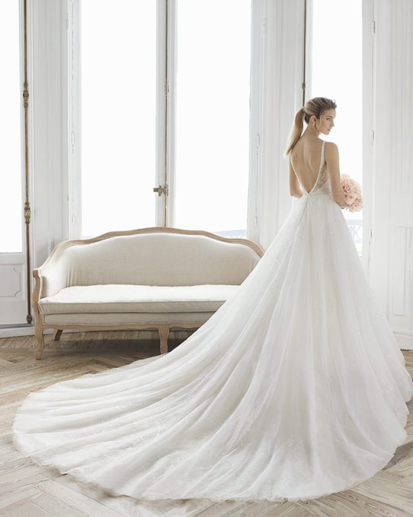 Rosa Clara Aire Estelar Wedding Dress - Elegant deep V neckline beaded ball gown with thin straps, open back and long train.