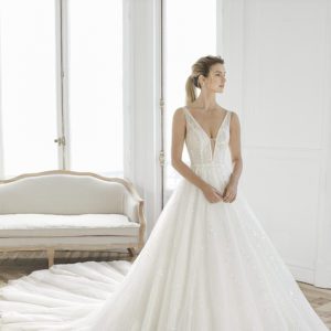 Rosa Clara Aire Estelar Wedding Dress - Elegant deep V neckline beaded ball gown with thin straps, open back and long train.