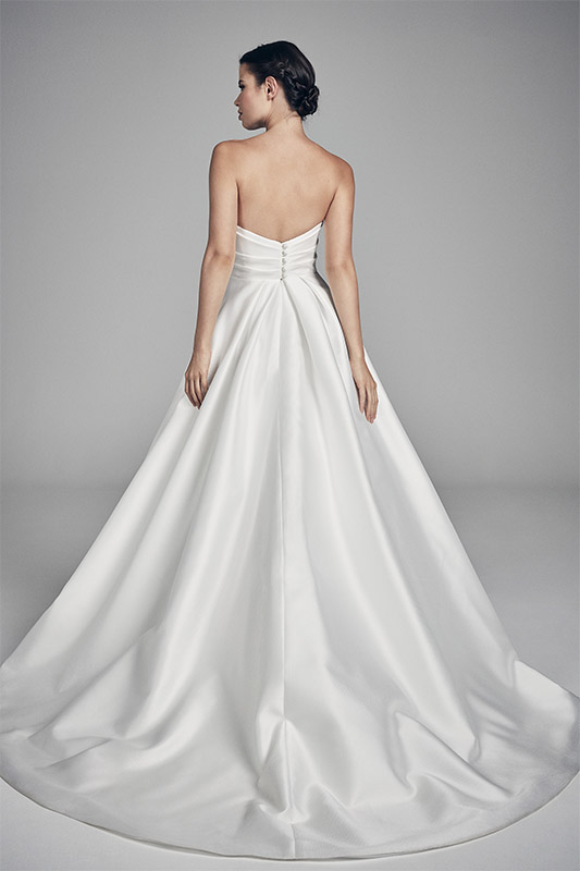 Suzanne Neville Amethyst Wedding Dress - Structured strapless A Line dress with wrap detail on bodice, a gorgeous sweeping train and chic pockets.